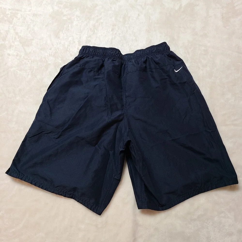 VTG NIKE gym Shorts Medium Mesh Lining Swim Trunks Swoosh Logo Pockets